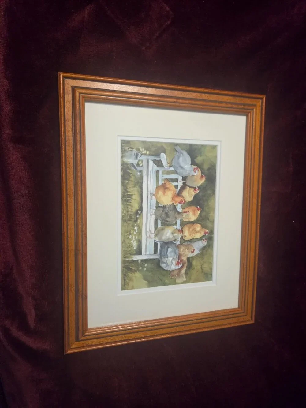 rustic watercolor painting with a line of colorful chickens perched together